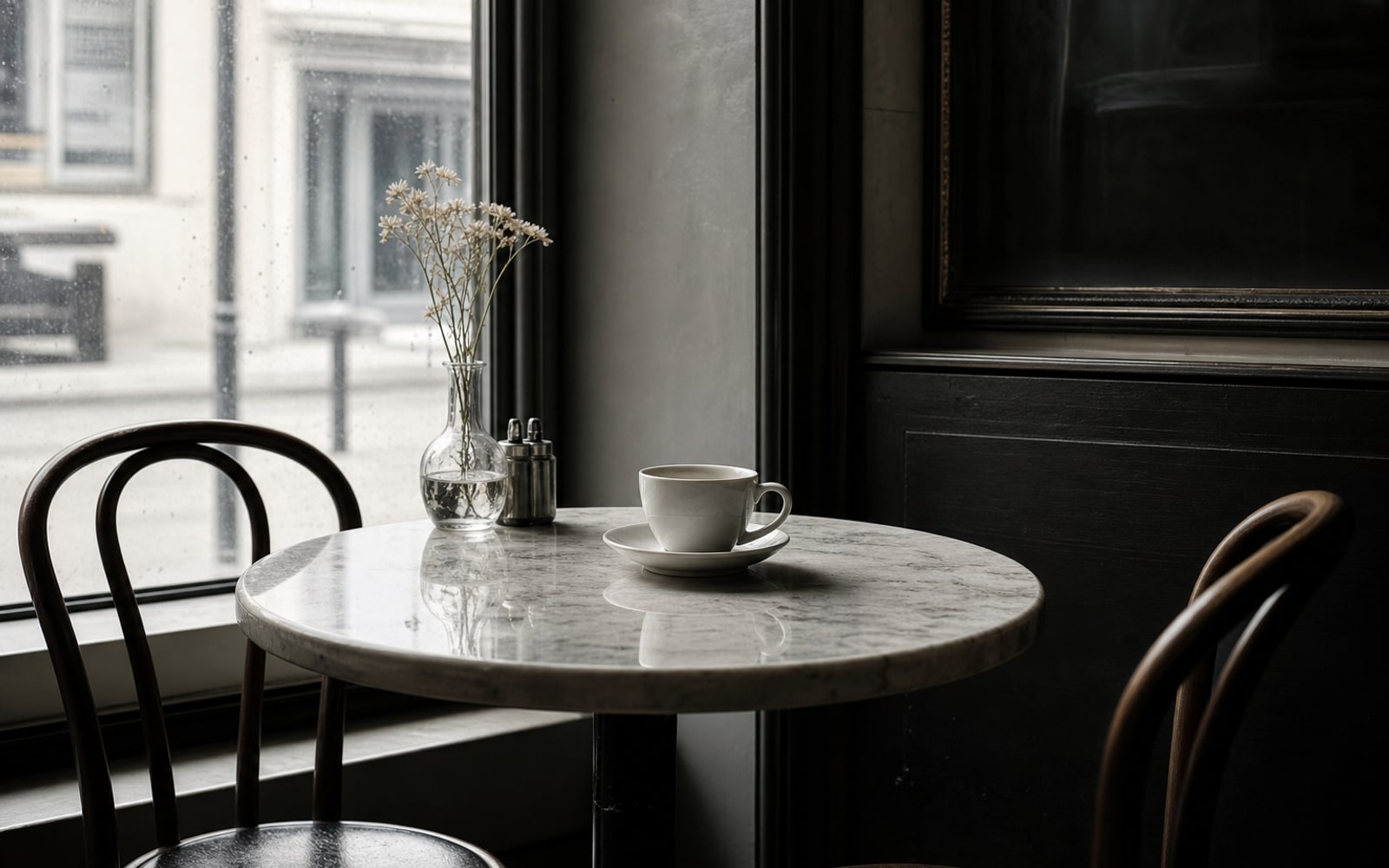 Empty cafe table for two with one untouched cup in soft morning light